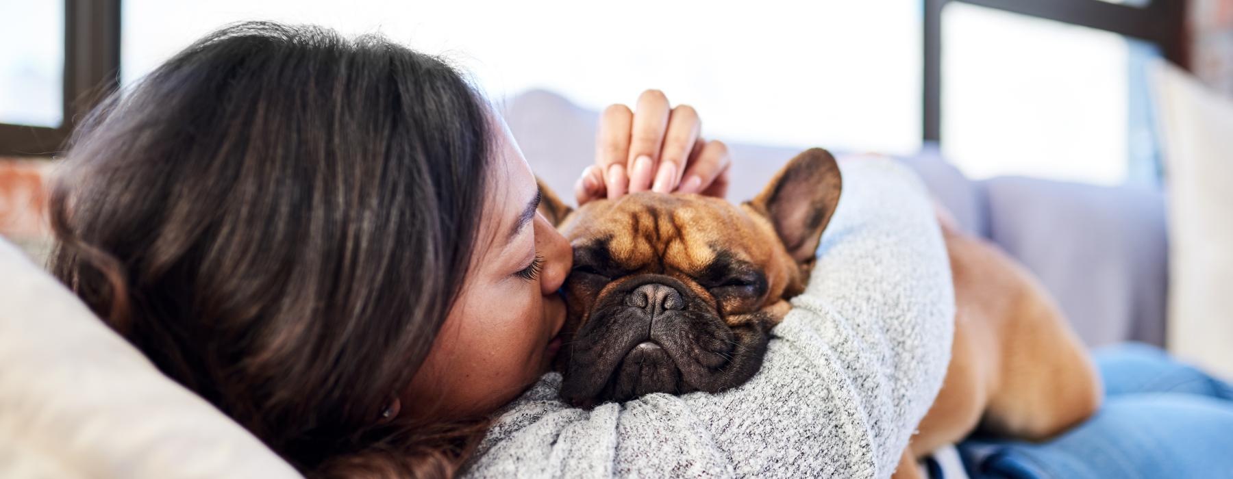 woman holding a dog